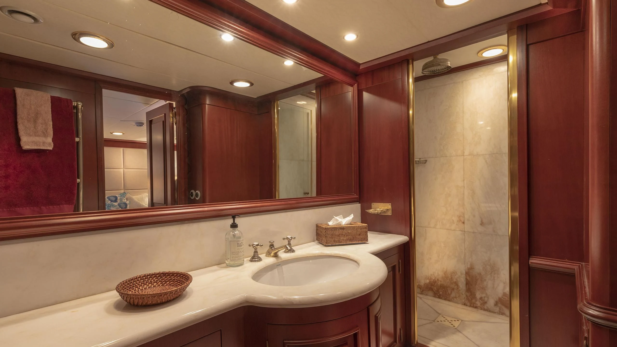a bathroom with a large mirror aboard MONTREVEL Yacht for Sale