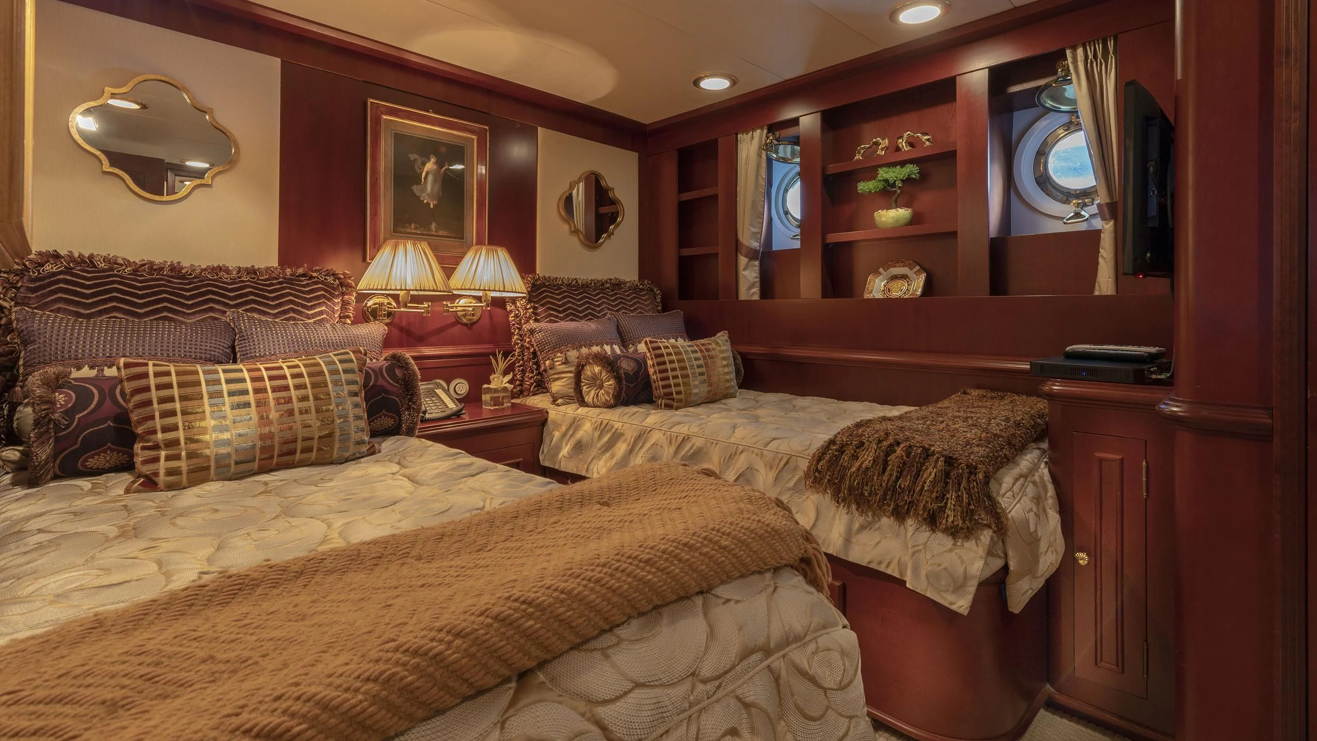 a room with a bed and a mirror aboard MONTREVEL Yacht for Sale