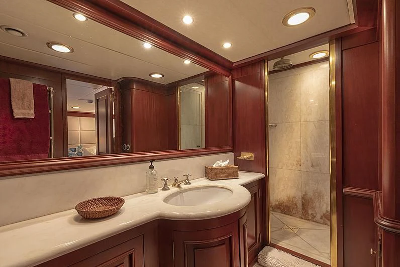 a bathroom with a large mirror aboard MONTREVEL Yacht for Sale