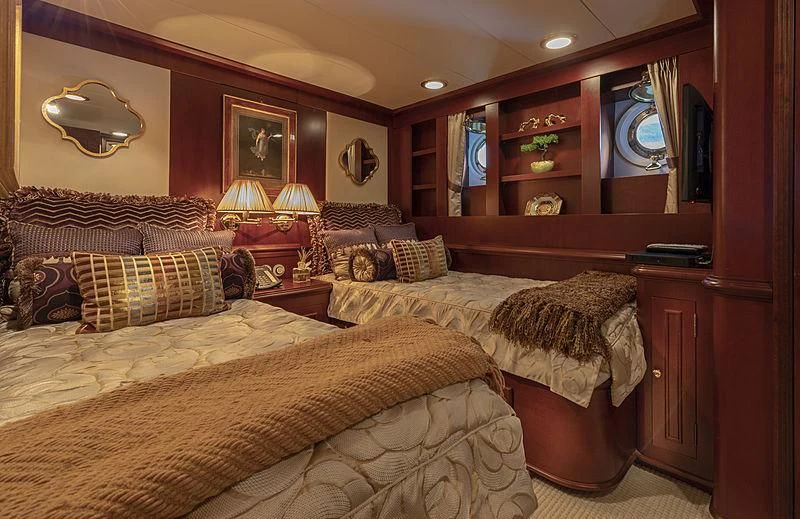 a bedroom with a couple of beds aboard MONTREVEL Yacht for Sale