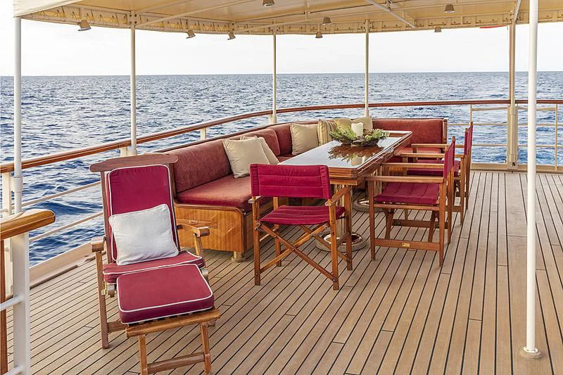 a table and chairs on a deck aboard MONTREVEL Yacht for Sale