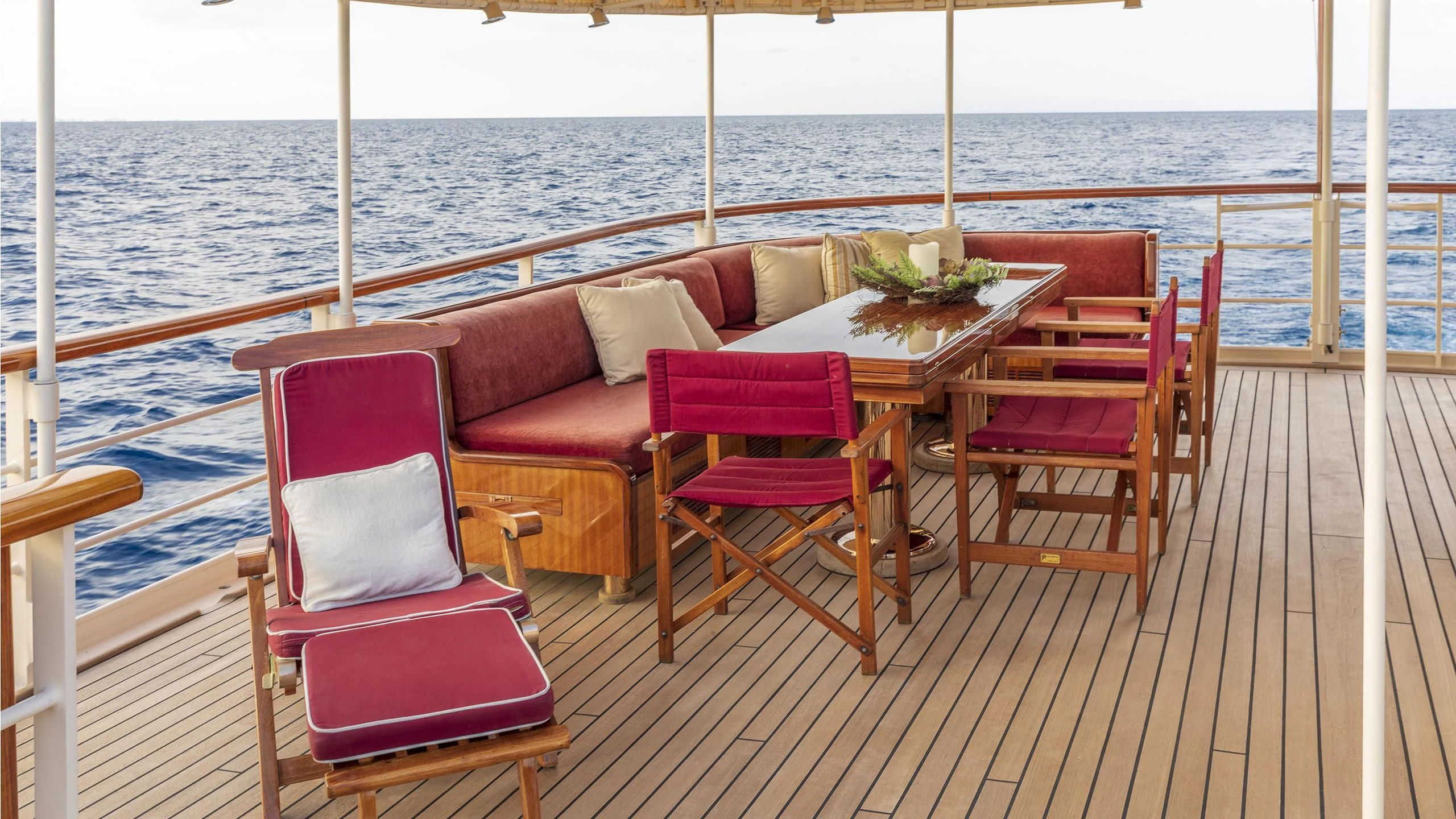 a table and chairs on a deck aboard MONTREVEL Yacht for Sale
