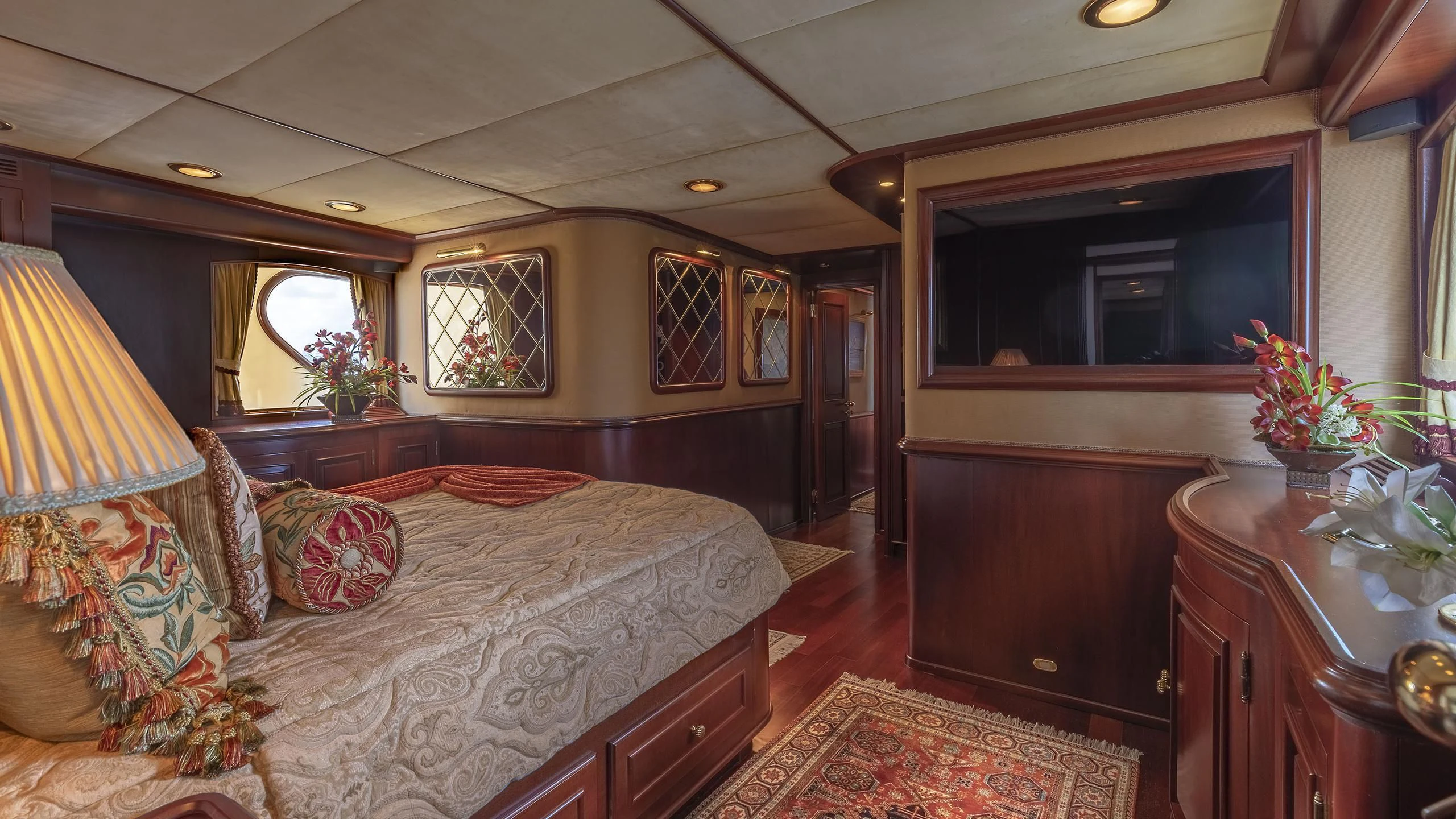 a bedroom with a bed and a desk aboard MONTREVEL Yacht for Sale