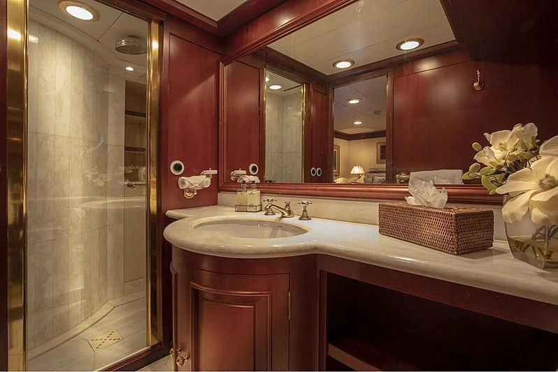 a bathroom with a large mirror aboard MONTREVEL Yacht for Sale