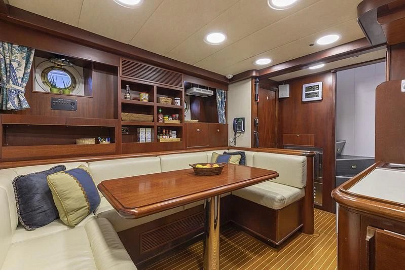 a living room with a couch and a table aboard MONTREVEL Yacht for Sale