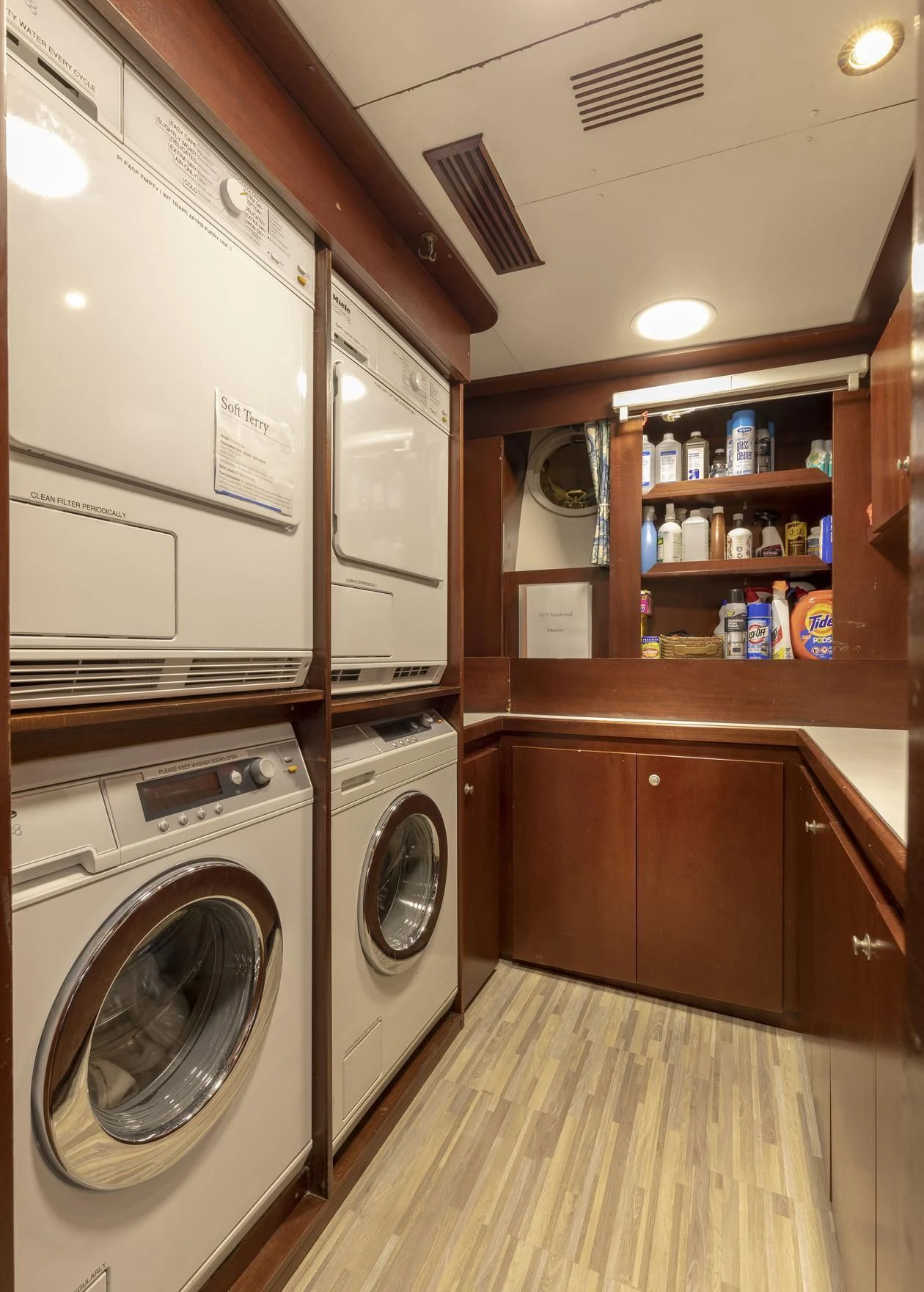 a laundry room with a washer and dryer aboard MONTREVEL Yacht for Sale
