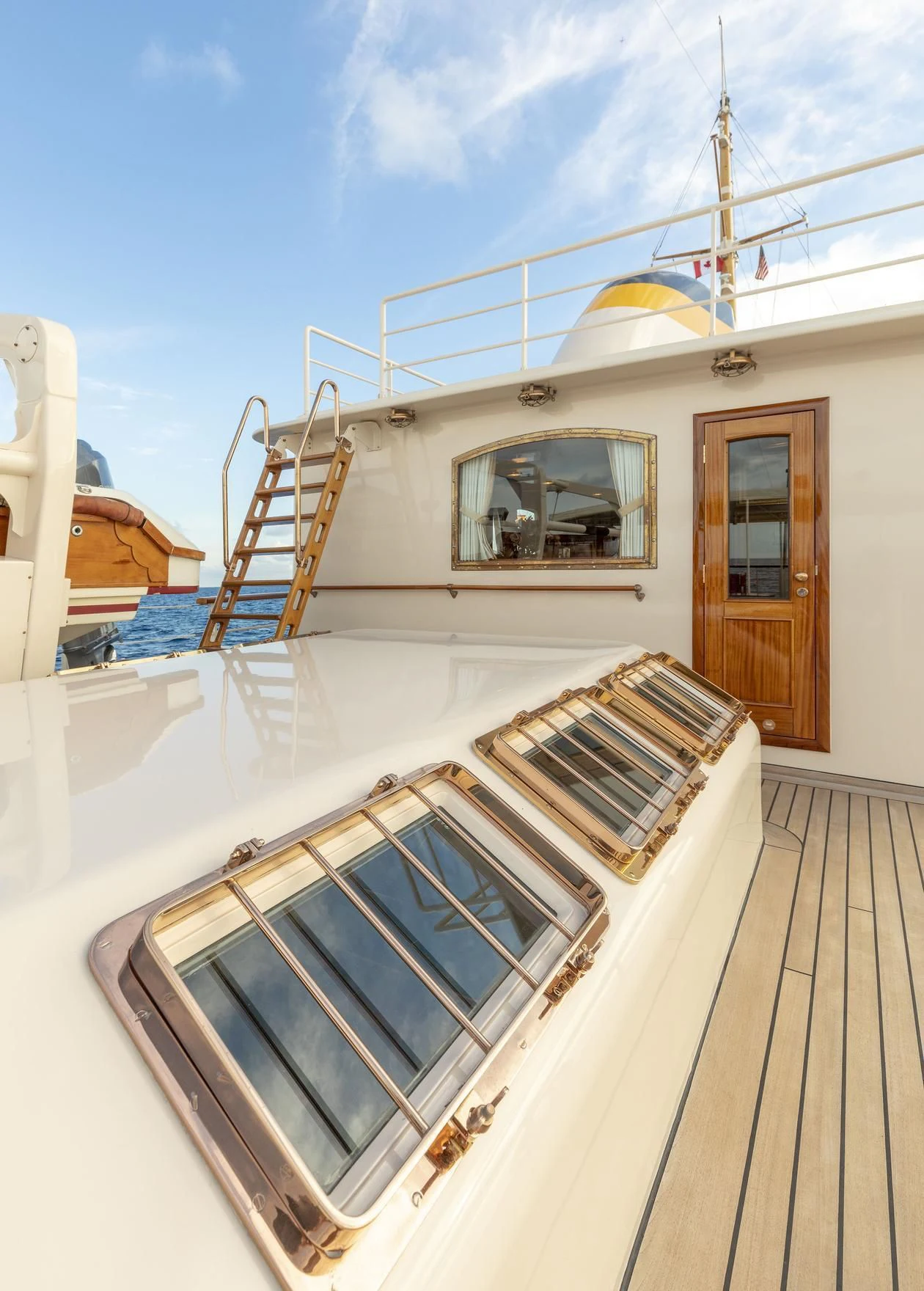 a white boat with a window aboard MONTREVEL Yacht for Sale