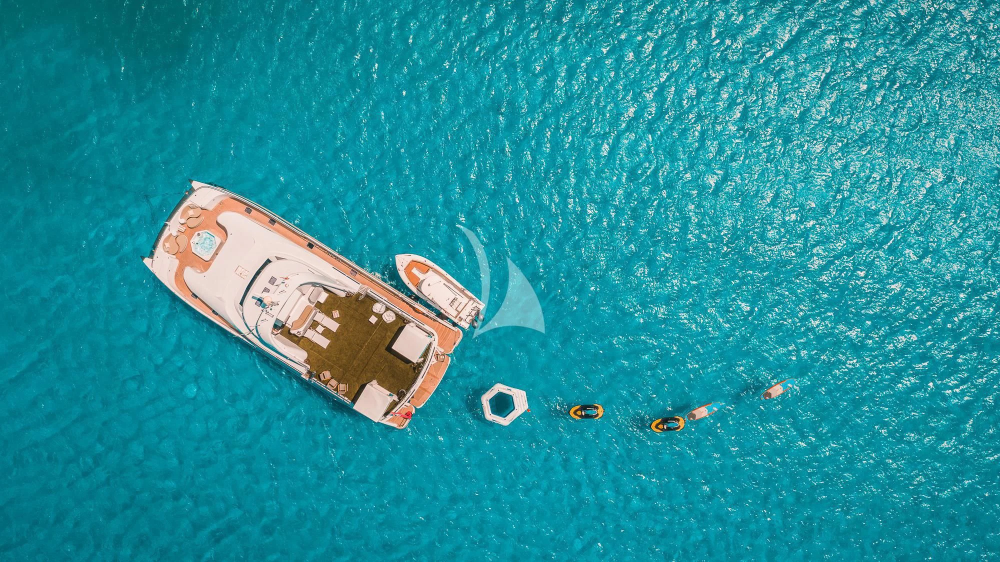 a small boat in the water aboard SAMARA Yacht for Charter