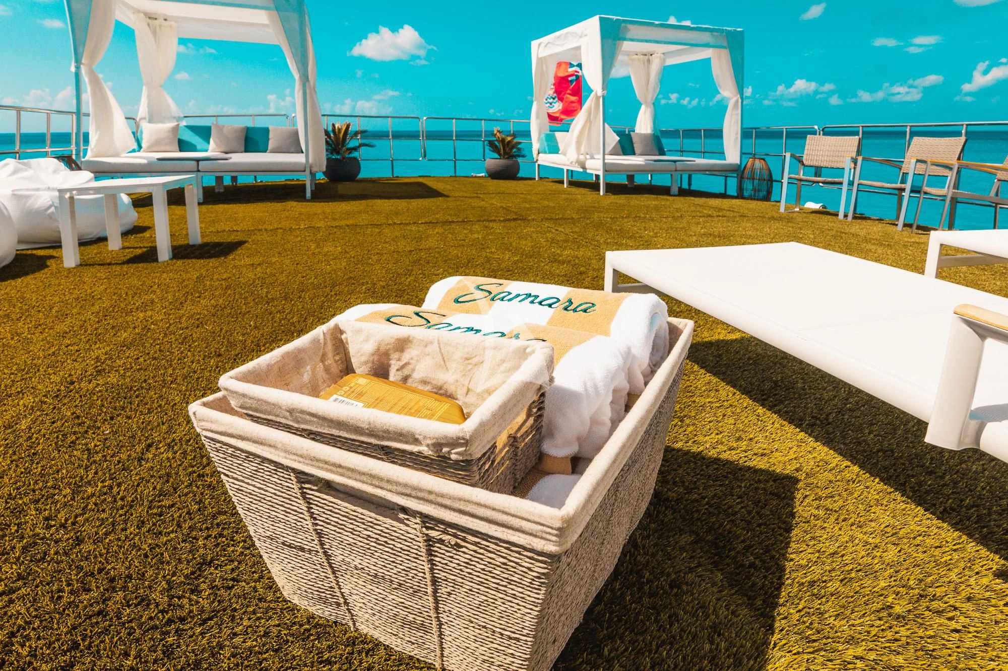 a lounge chair on a green carpet aboard SAMARA Yacht for Charter
