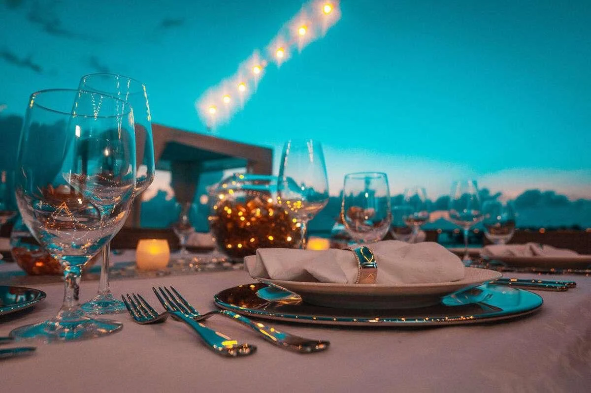 a table with plates and glasses aboard SAMARA Yacht for Charter