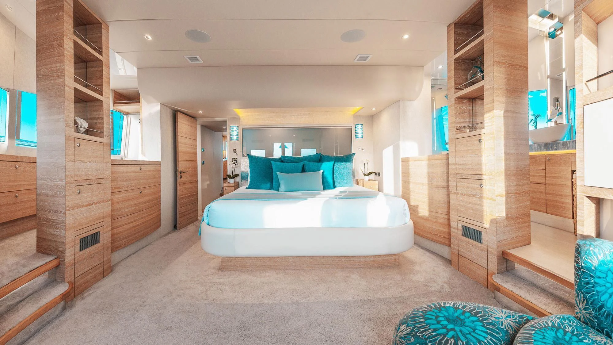 a large room with a bed and a wood door aboard SAMARA Yacht for Charter