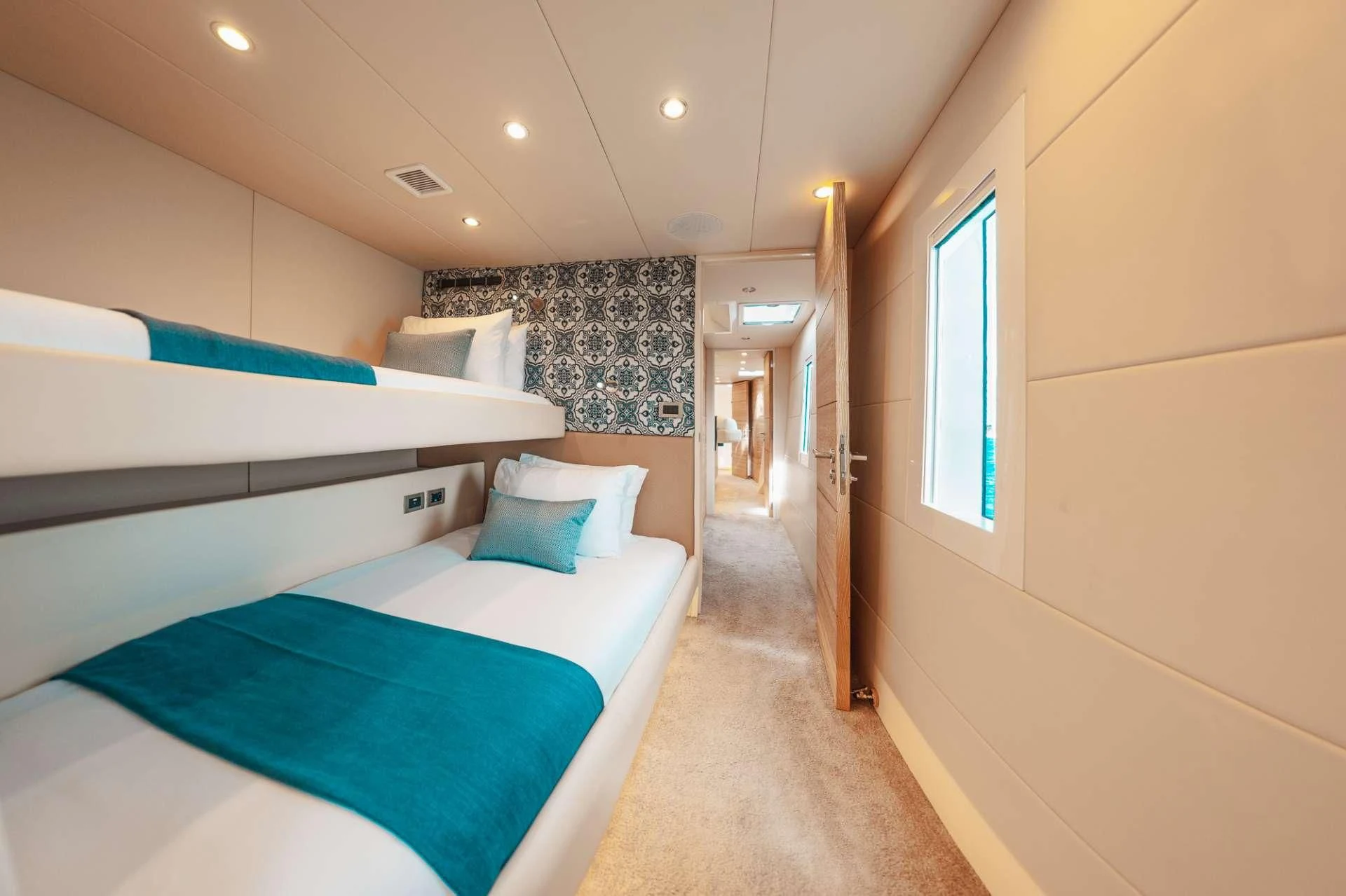 a room with a bed and a door aboard SAMARA Yacht for Charter
