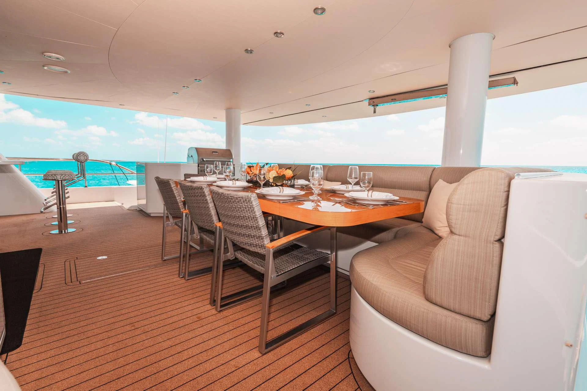 a room with a table and chairs aboard SAMARA Yacht for Charter
