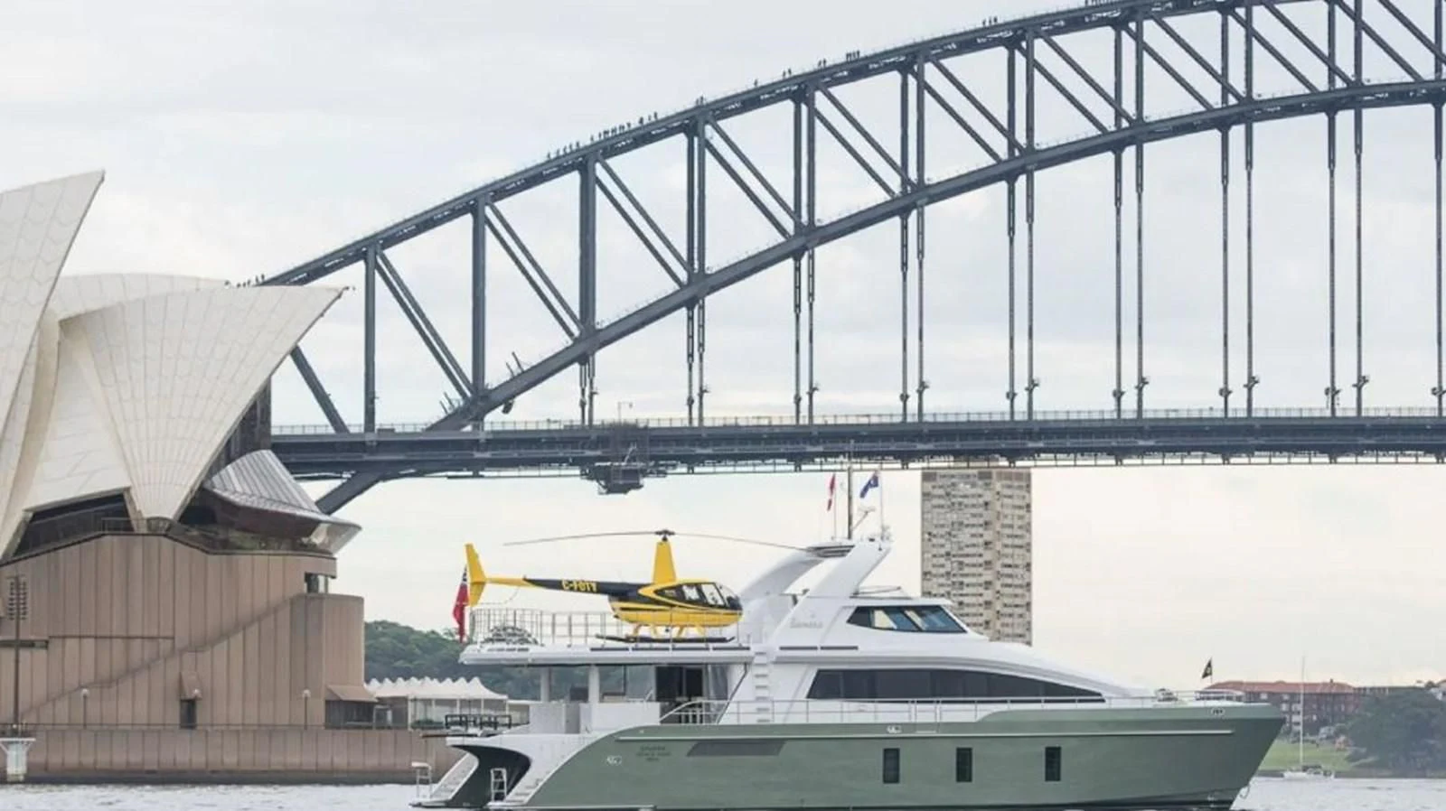 a plane flying over a bridge aboard SAMARA Yacht for Charter