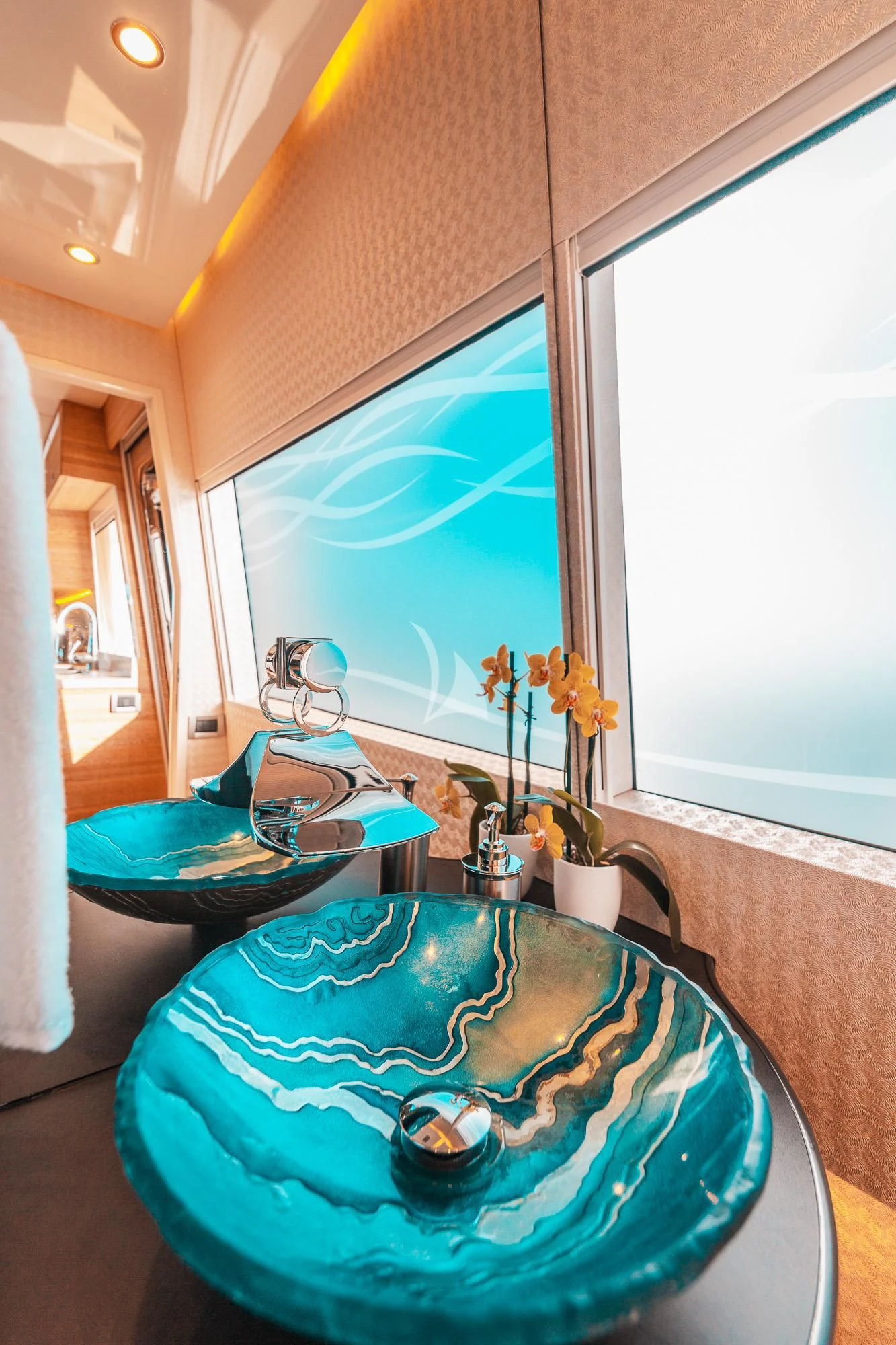 a bathroom with a sink and a window aboard SAMARA Yacht for Charter