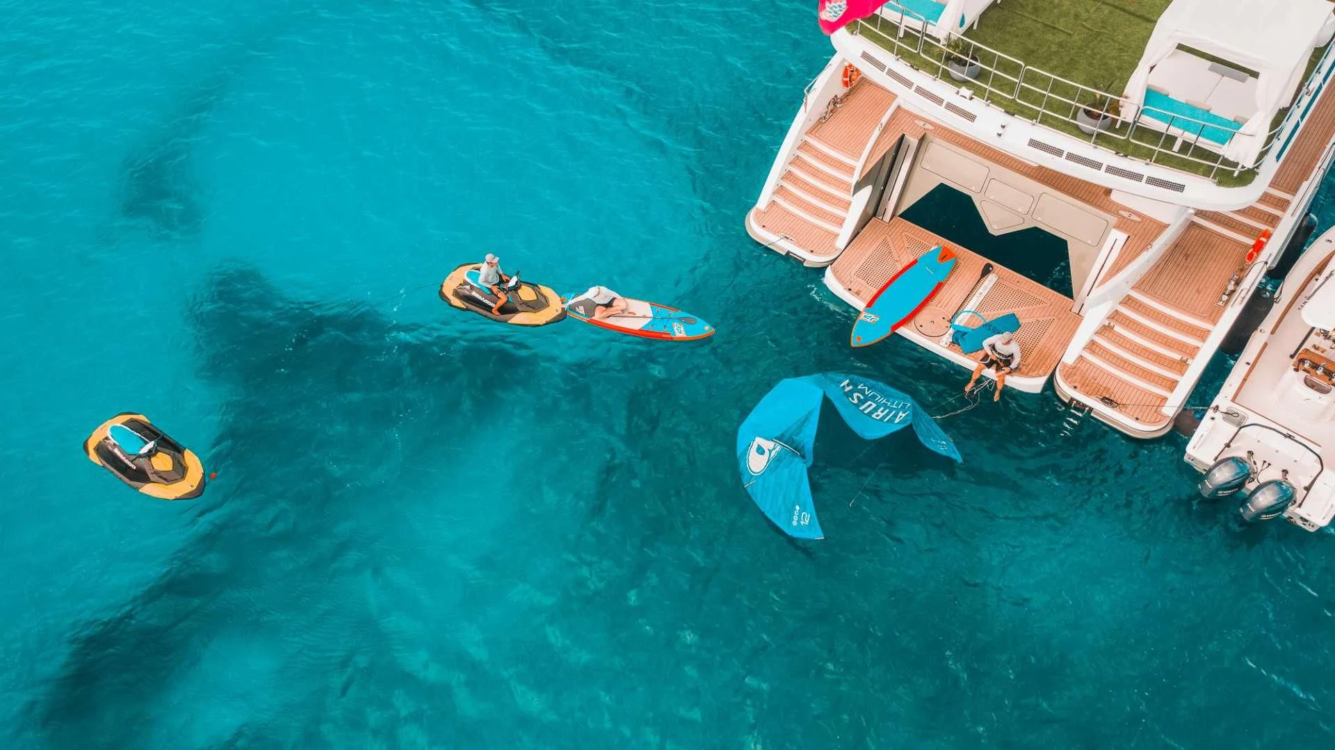 a group of people on boats in the water aboard SAMARA Yacht for Charter