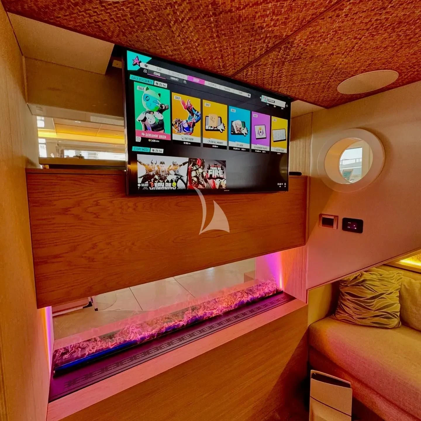 a room with a tv and a couch aboard SAMARA Yacht for Charter