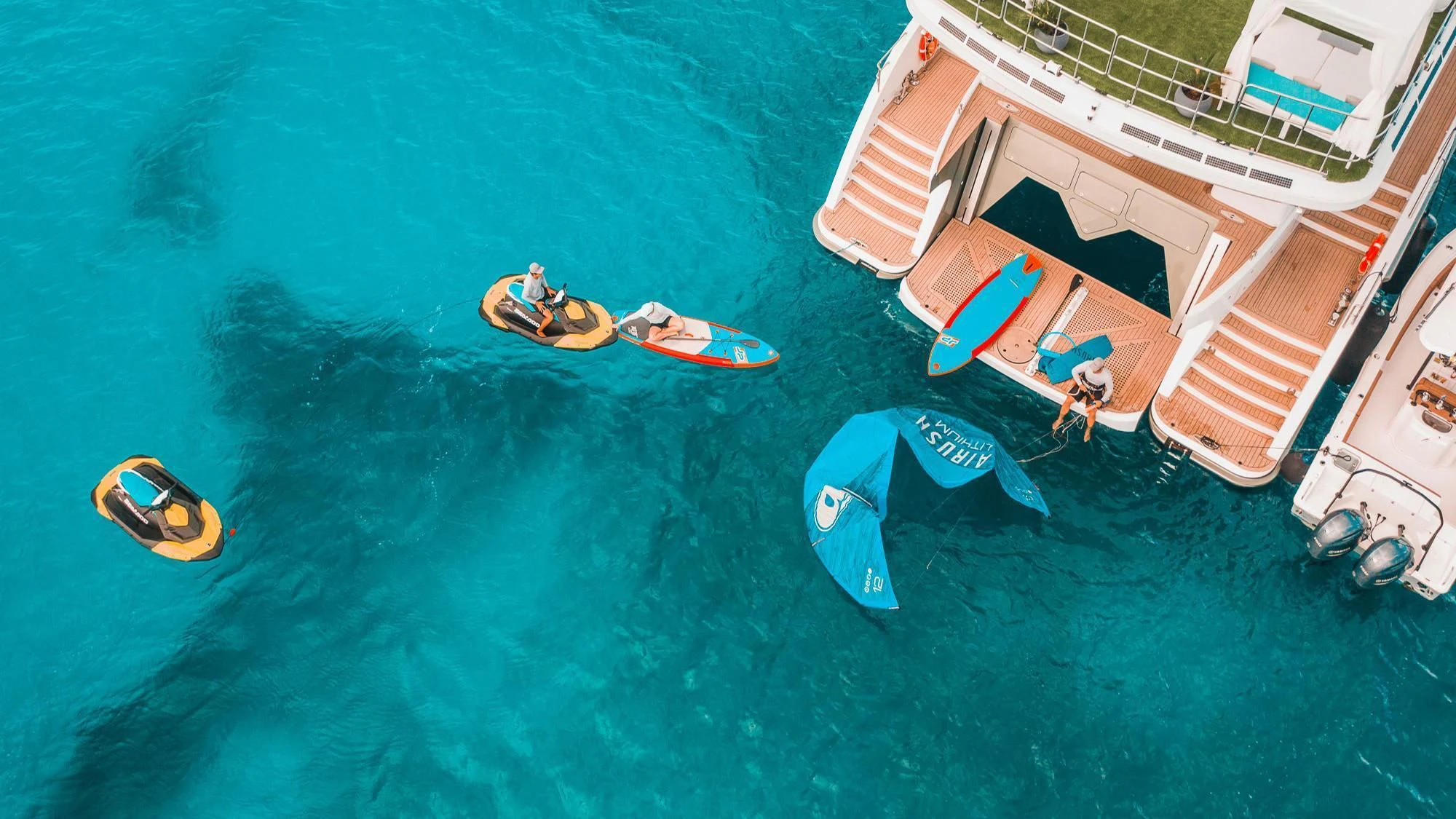 a group of people on a beach aboard SAMARA Yacht for Charter