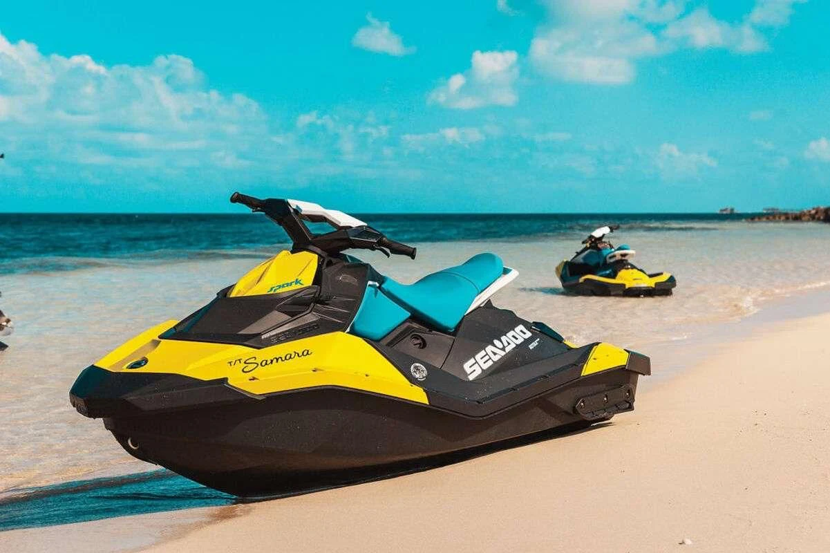 a couple of speed boats on a beach aboard SAMARA Yacht for Charter