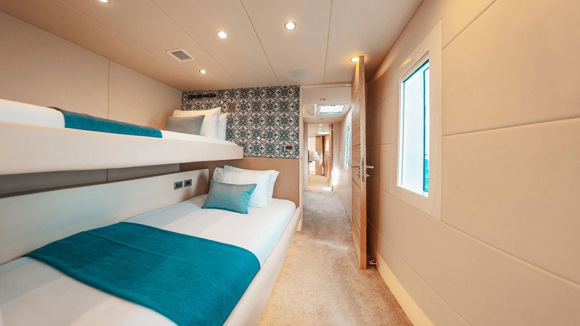 a room with a bed and a door aboard SAMARA Yacht for Charter