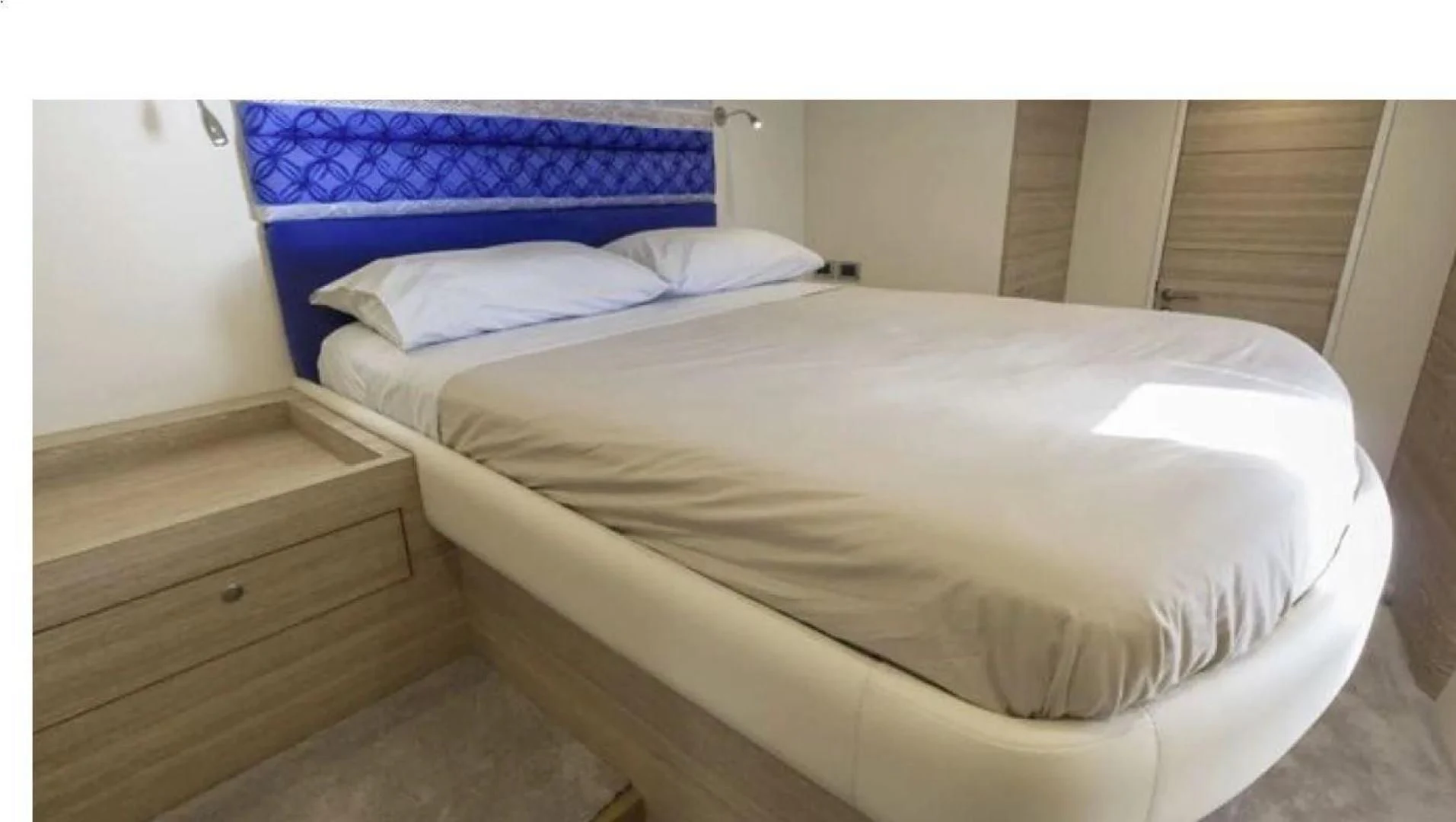 a couple of beds in a room aboard SAMARA Yacht for Charter