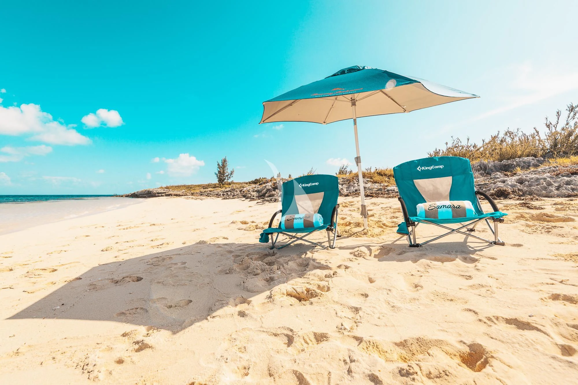 chairs and umbrella on a beach aboard SAMARA Yacht for Charter