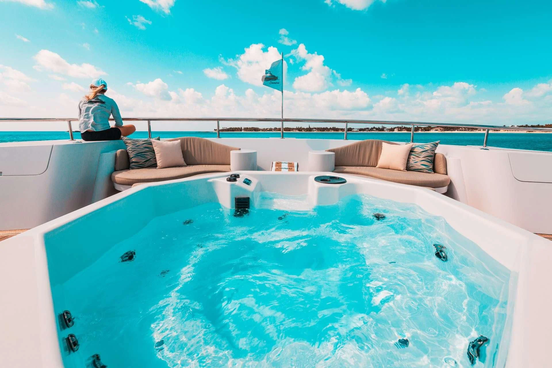 a person standing next to a pool aboard SAMARA Yacht for Charter