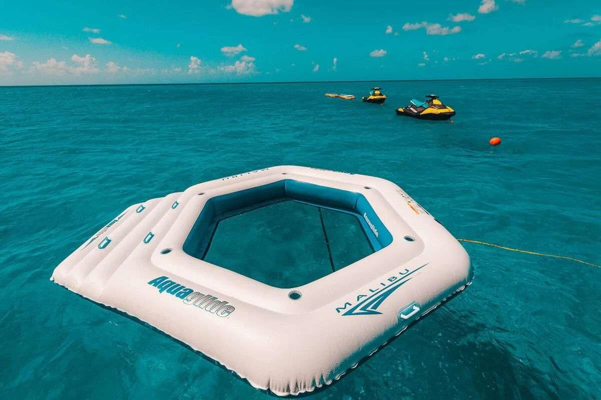 a white car in the water aboard SAMARA Yacht for Charter