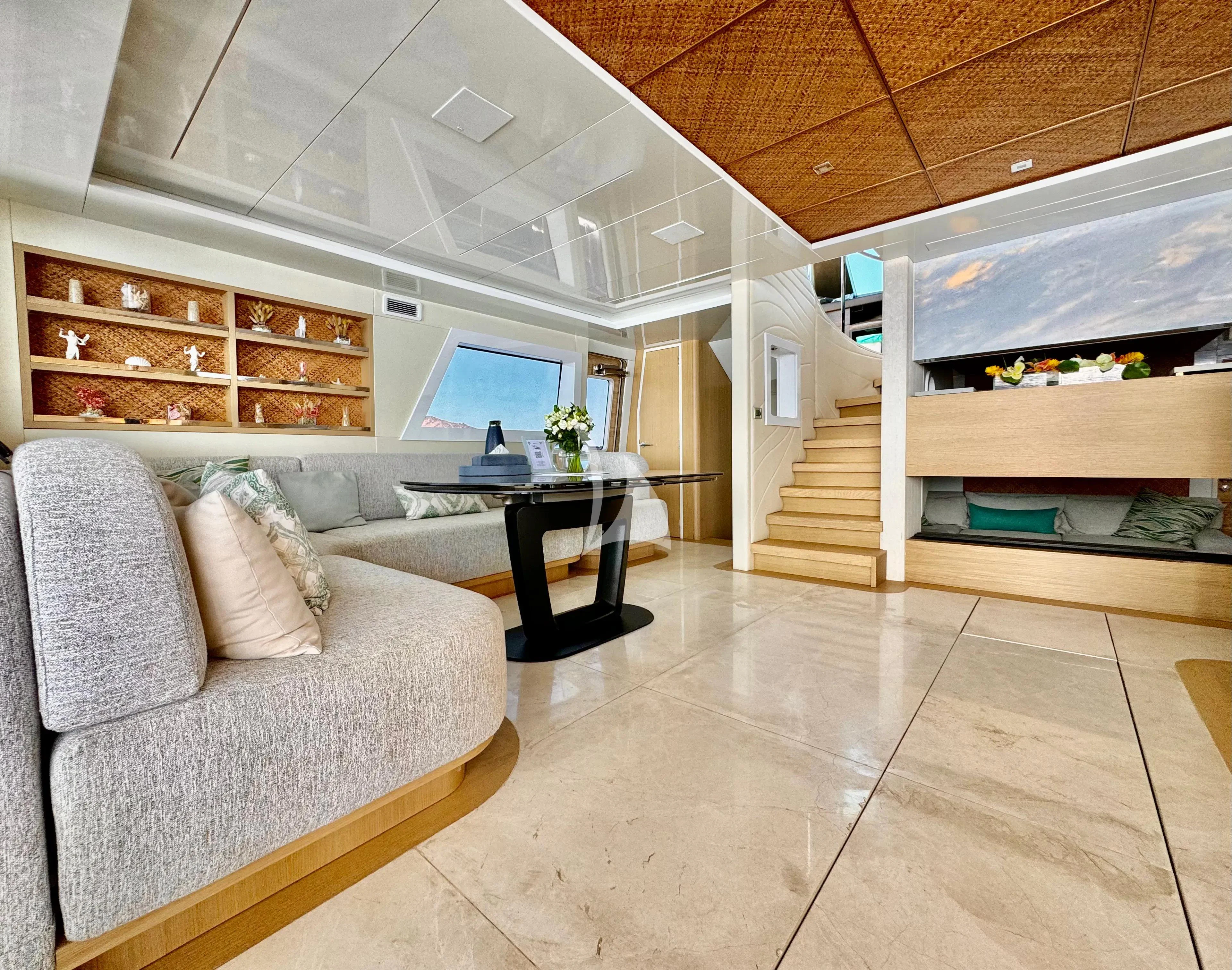 a living room with a couch and a table aboard SAMARA Yacht for Charter