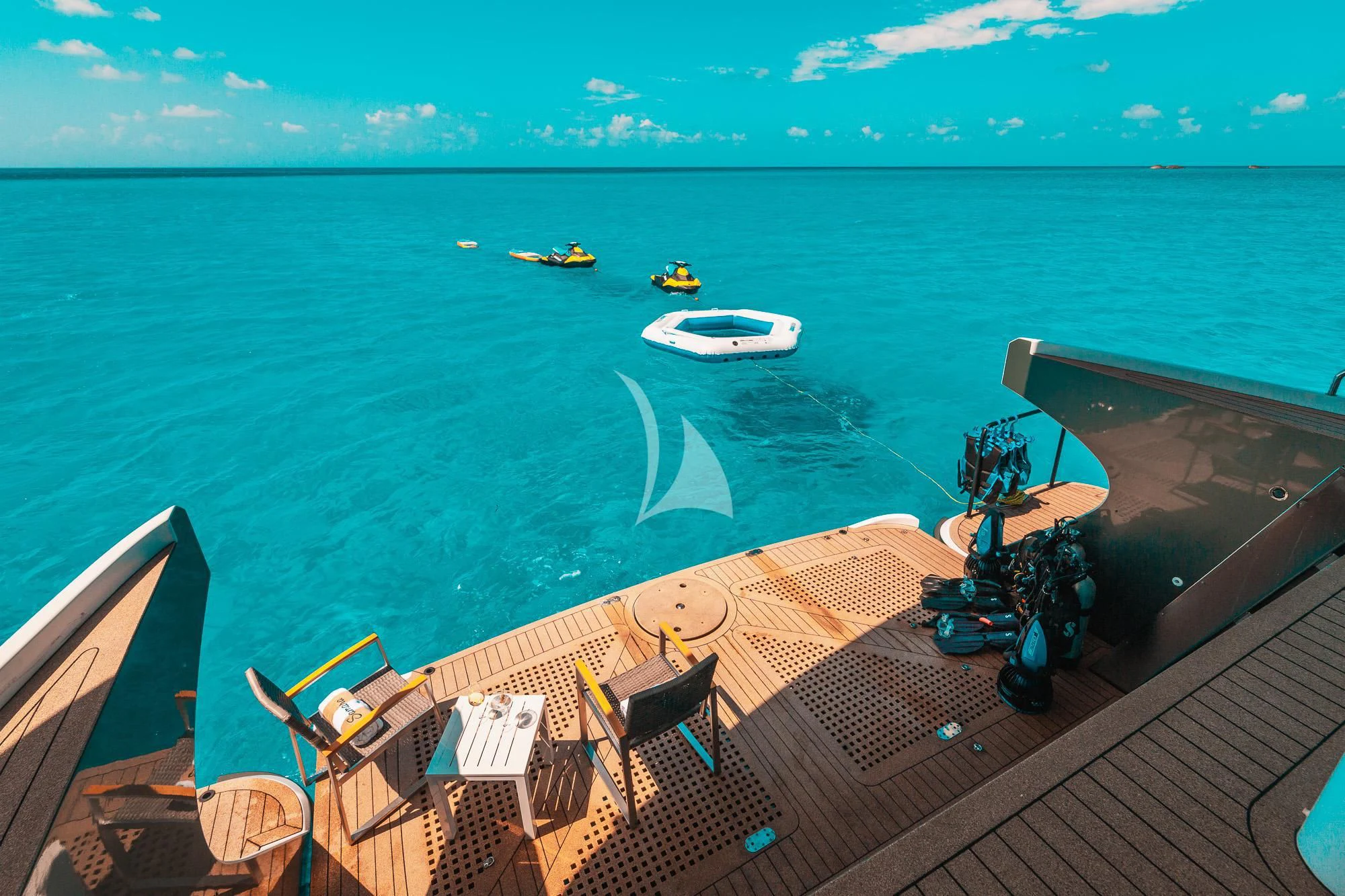 a deck with boats and people on it by the water aboard SAMARA Yacht for Charter