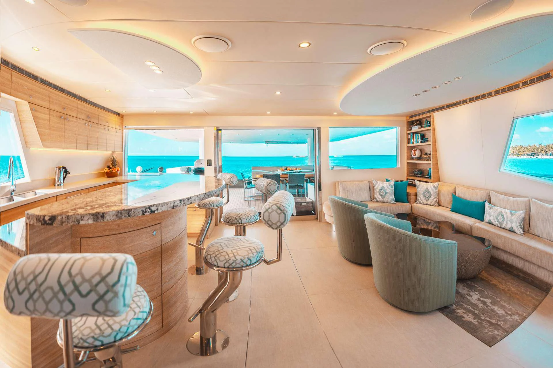 a living room with a large window aboard SAMARA Yacht for Charter