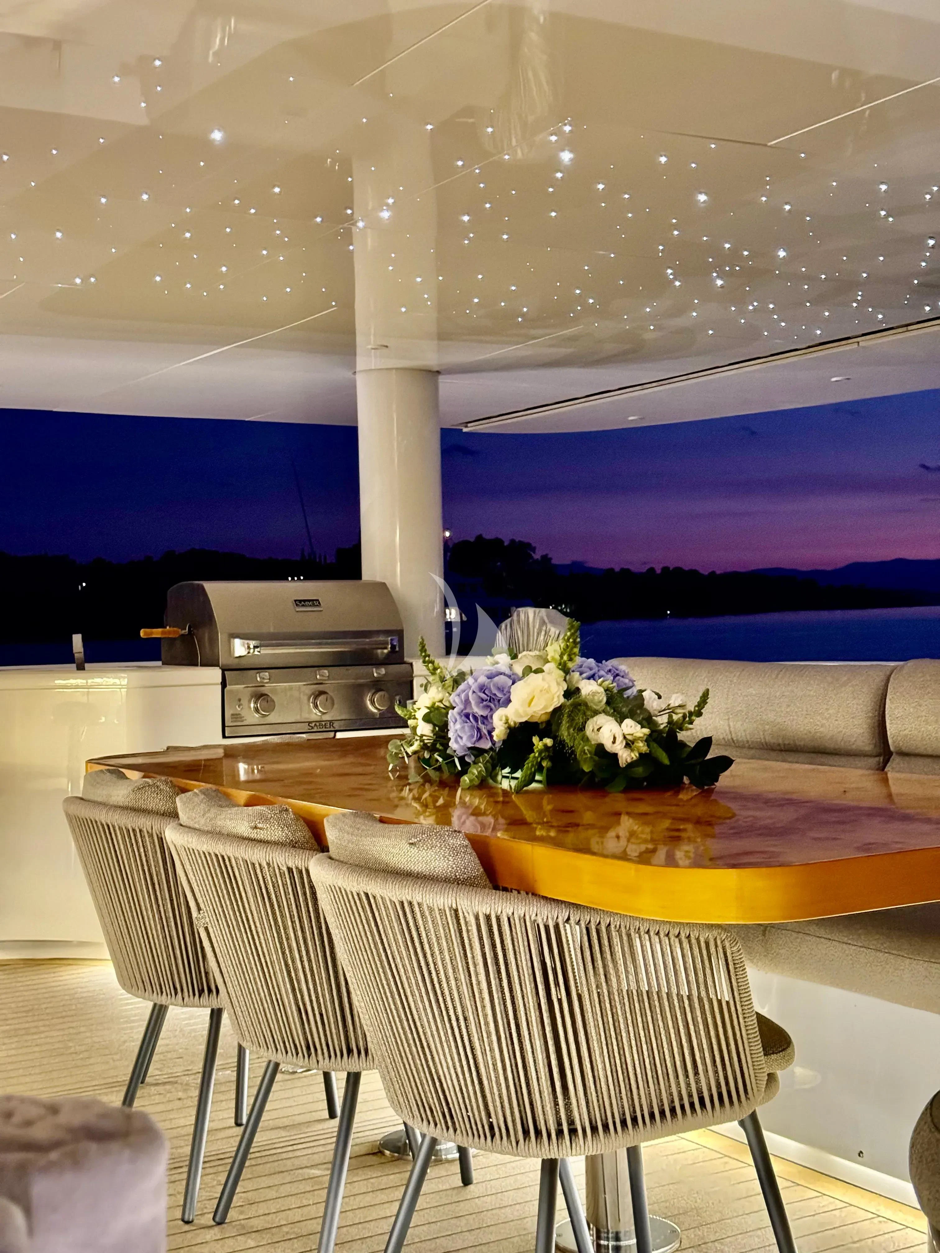 a room with a table and chairs aboard SAMARA Yacht for Charter