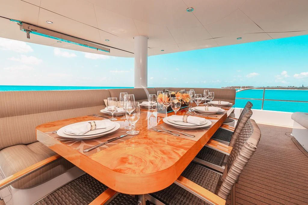 a table set for a dinner on a boat aboard SAMARA Yacht for Charter