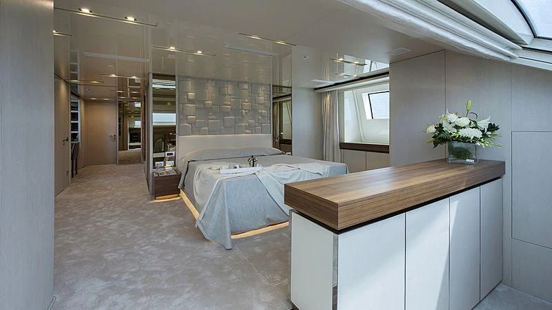 a room with a desk and a bed aboard OCTAVE Yacht for Sale