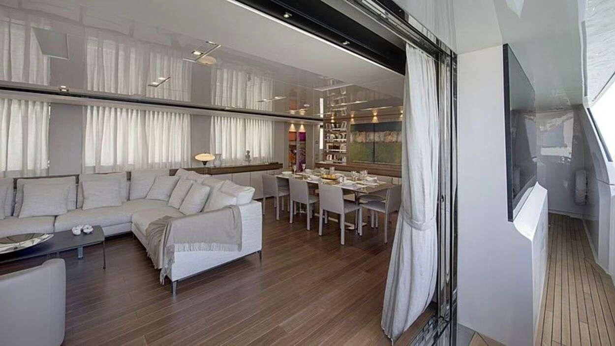 a room with a bed and a table aboard OCTAVE Yacht for Sale