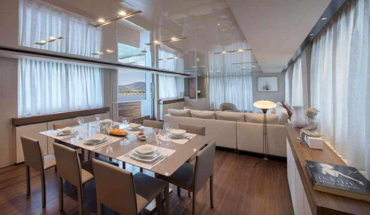 a large room with a table and chairs aboard OCTAVE Yacht for Sale