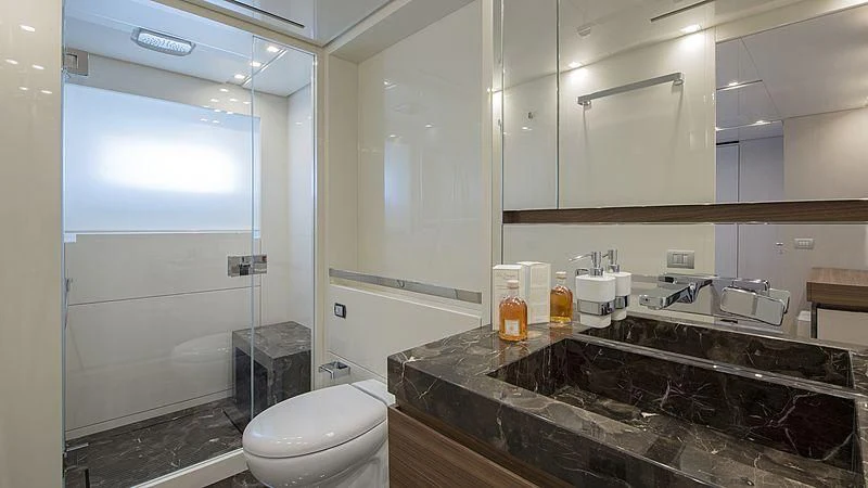 a bathroom with a glass shower aboard OCTAVE Yacht for Sale