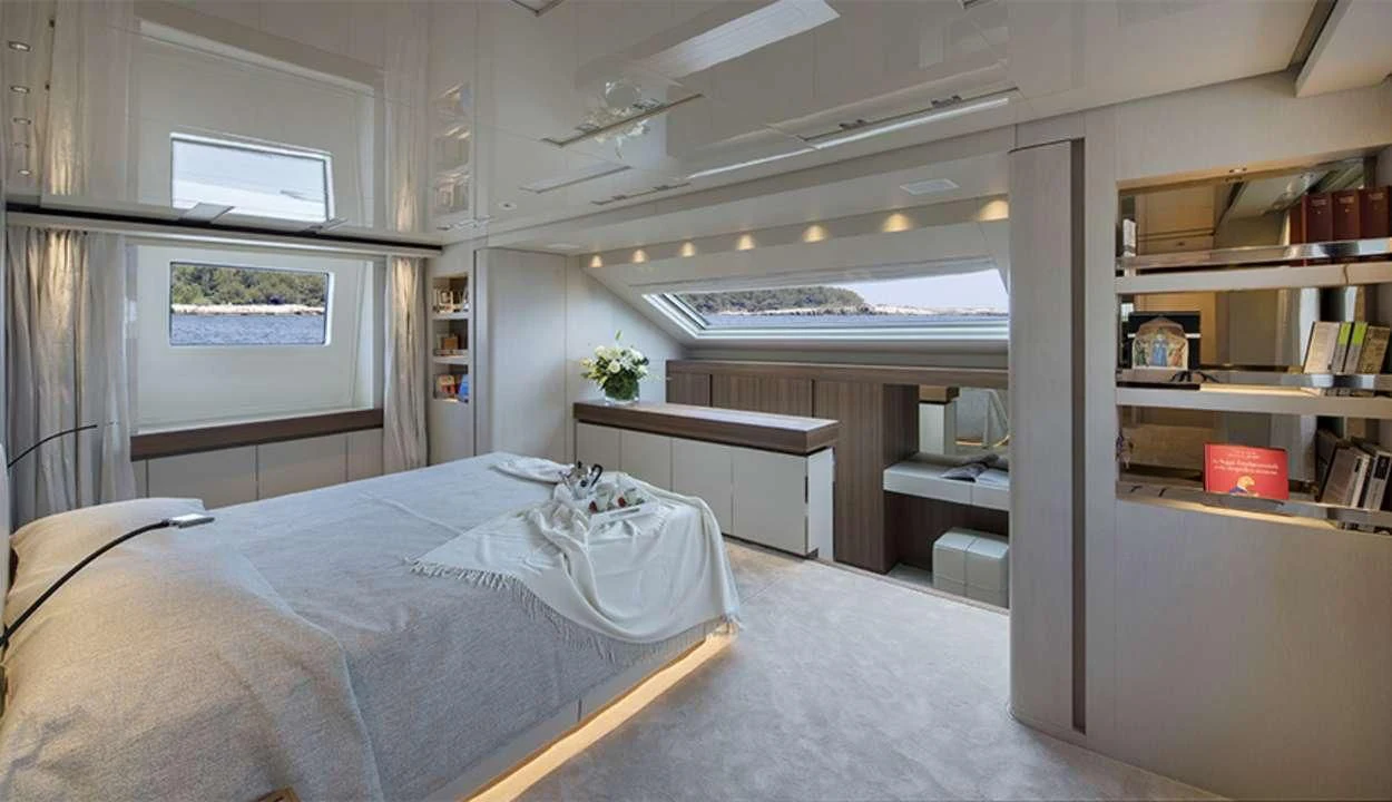 a room with a bed and shelves aboard OCTAVE Yacht for Sale