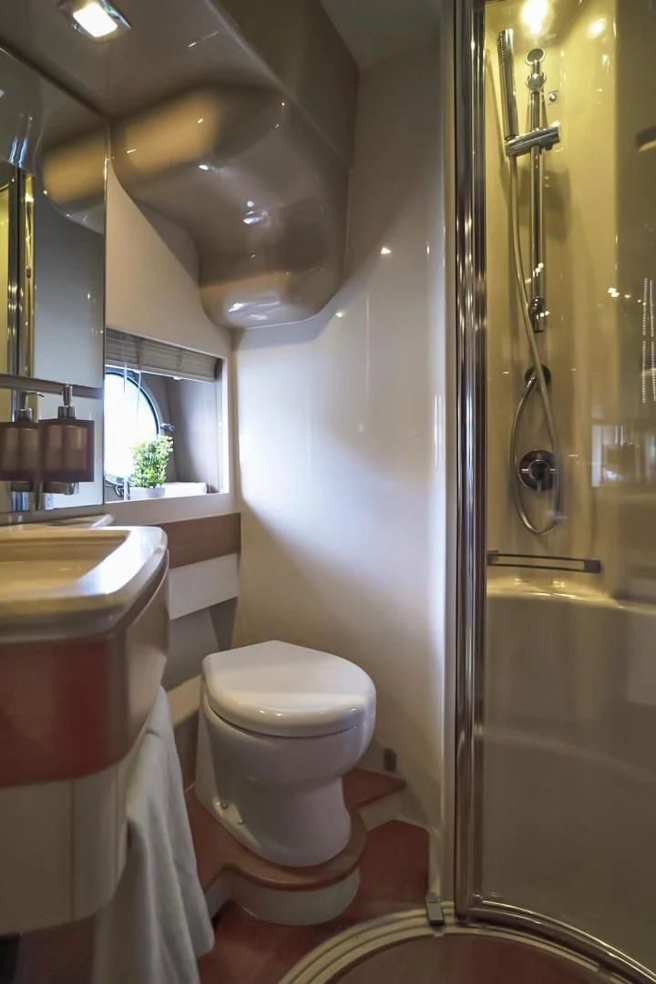 a bathroom with a toilet and sink aboard WICKED Yacht for Sale