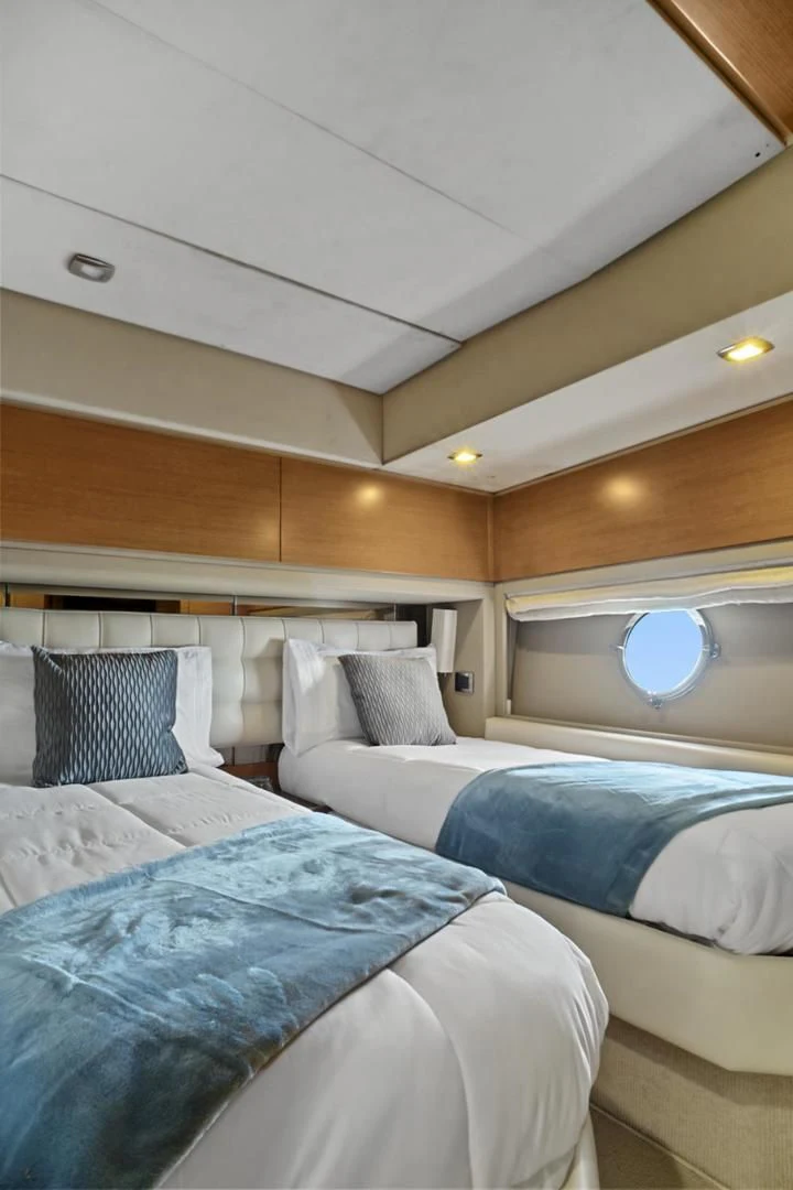 a couple of beds in a room aboard WICKED Yacht for Sale