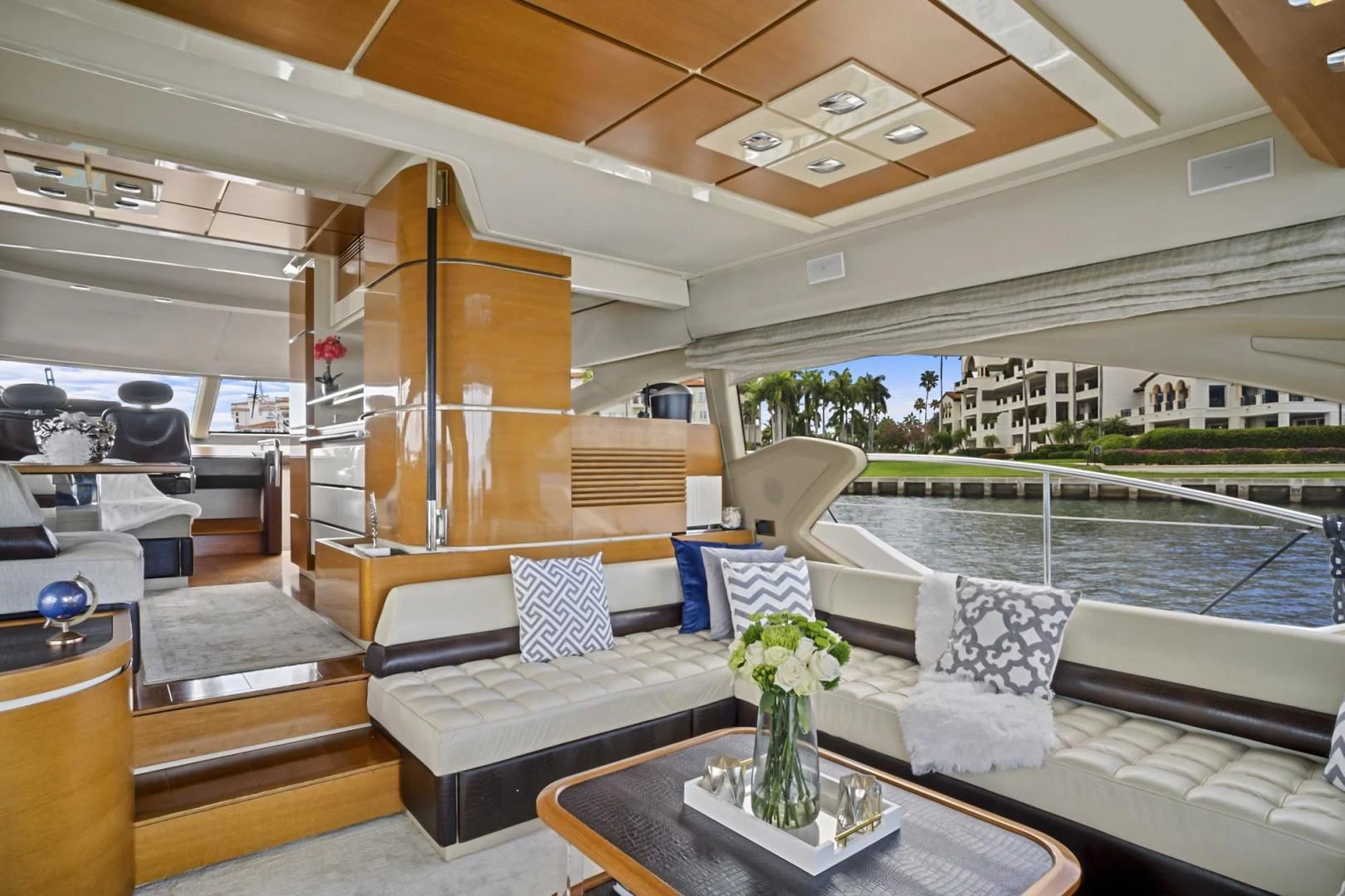 a living room with a large balcony aboard WICKED Yacht for Sale