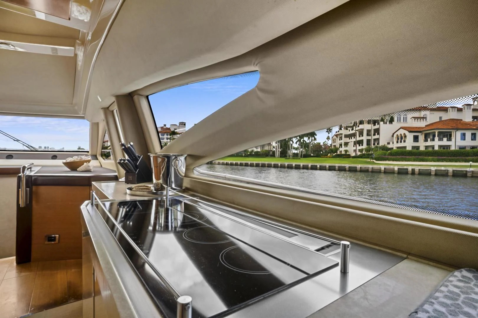 a large balcony overlooking a body of water aboard WICKED Yacht for Sale