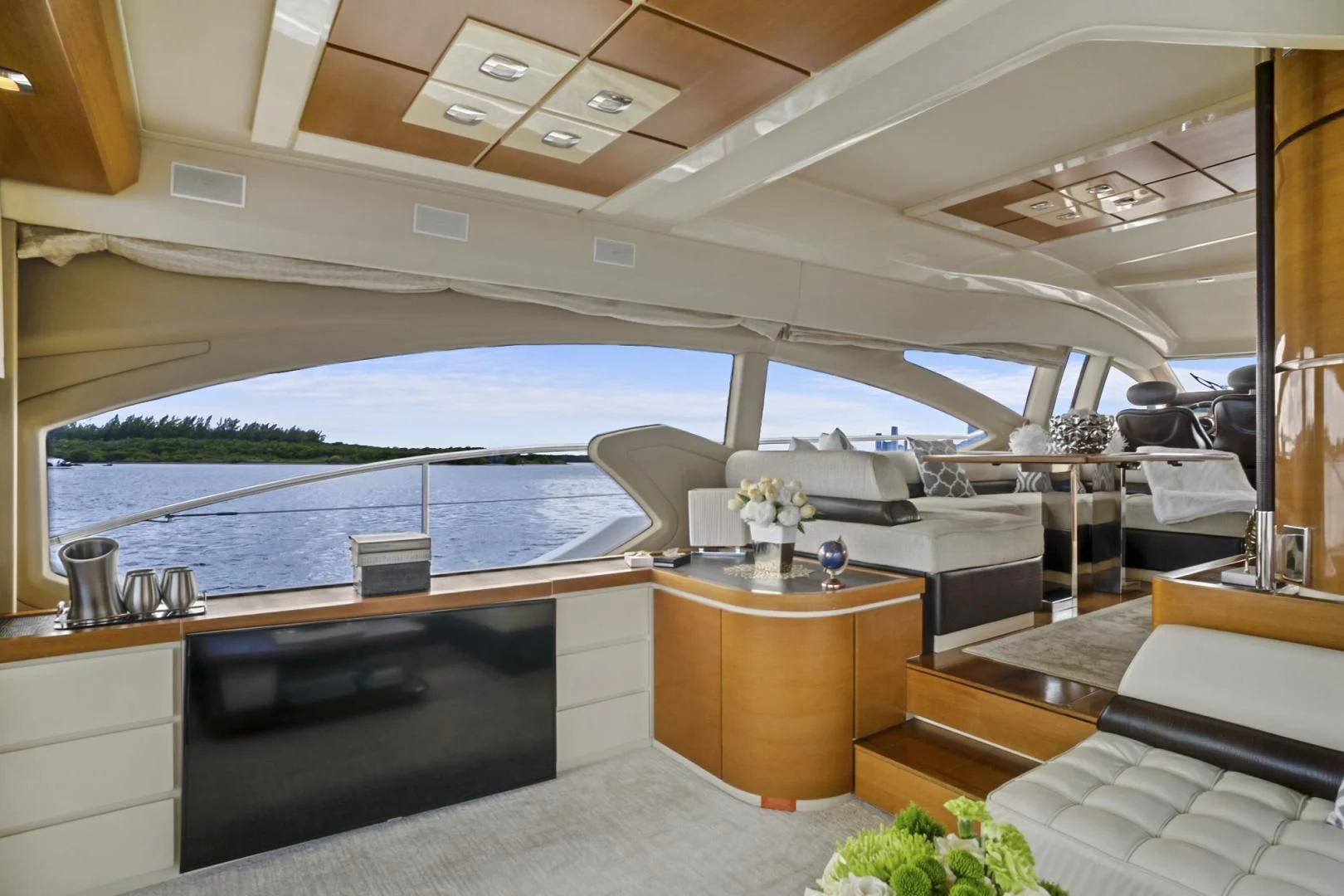 a room with a large window and a view of the ocean aboard WICKED Yacht for Sale