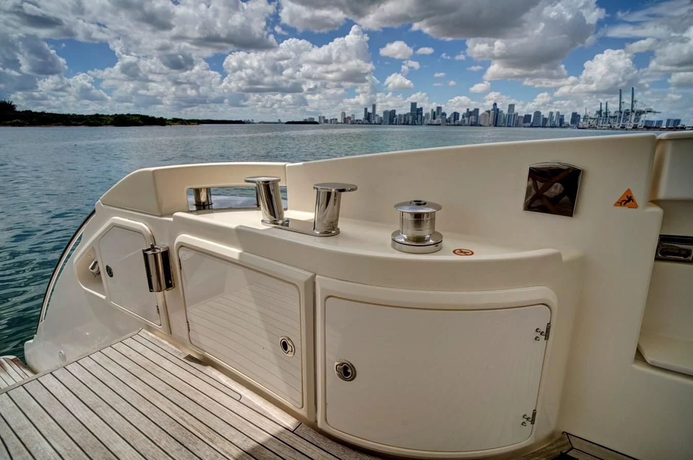 a white boat on a dock aboard WICKED Yacht for Sale