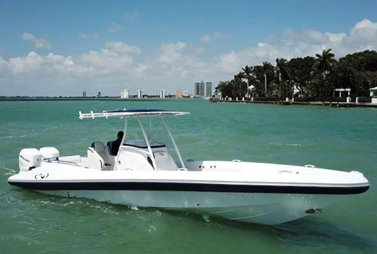 a white boat in the water aboard WICKED Yacht for Sale