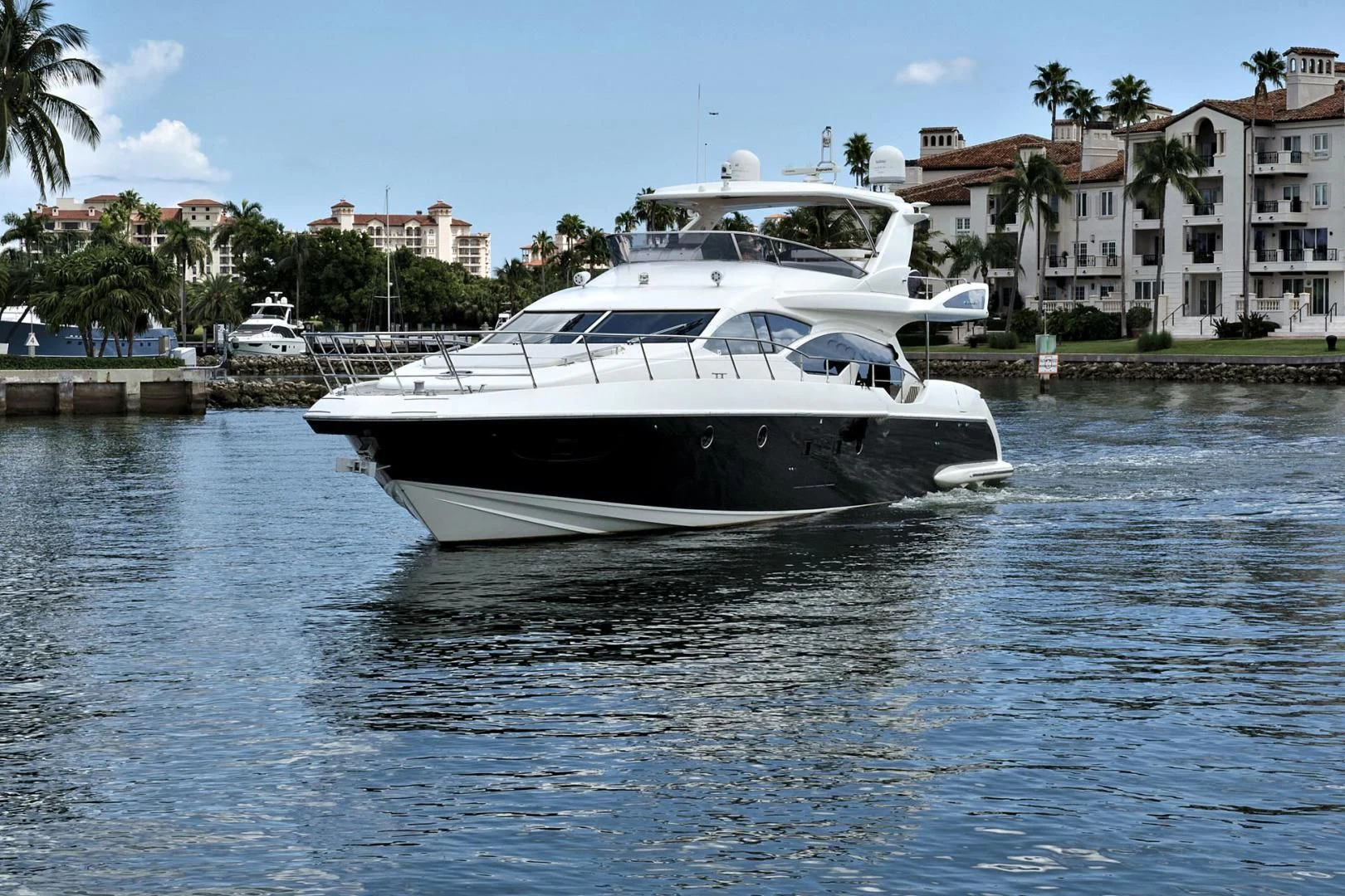 a white boat on the water aboard WICKED Yacht for Sale
