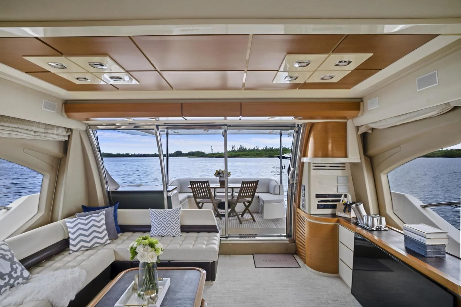 a living room with a large window aboard WICKED Yacht for Sale