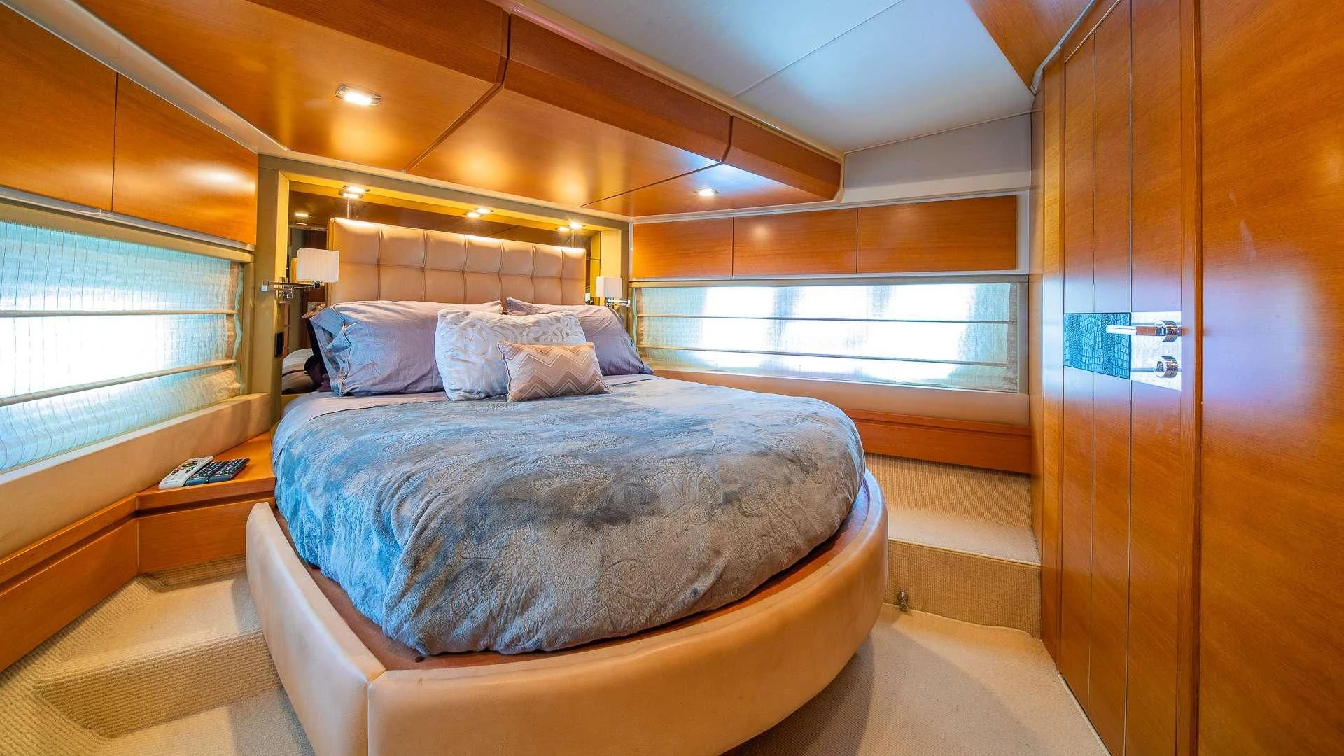 a room with a bed and a window aboard WICKED Yacht for Sale