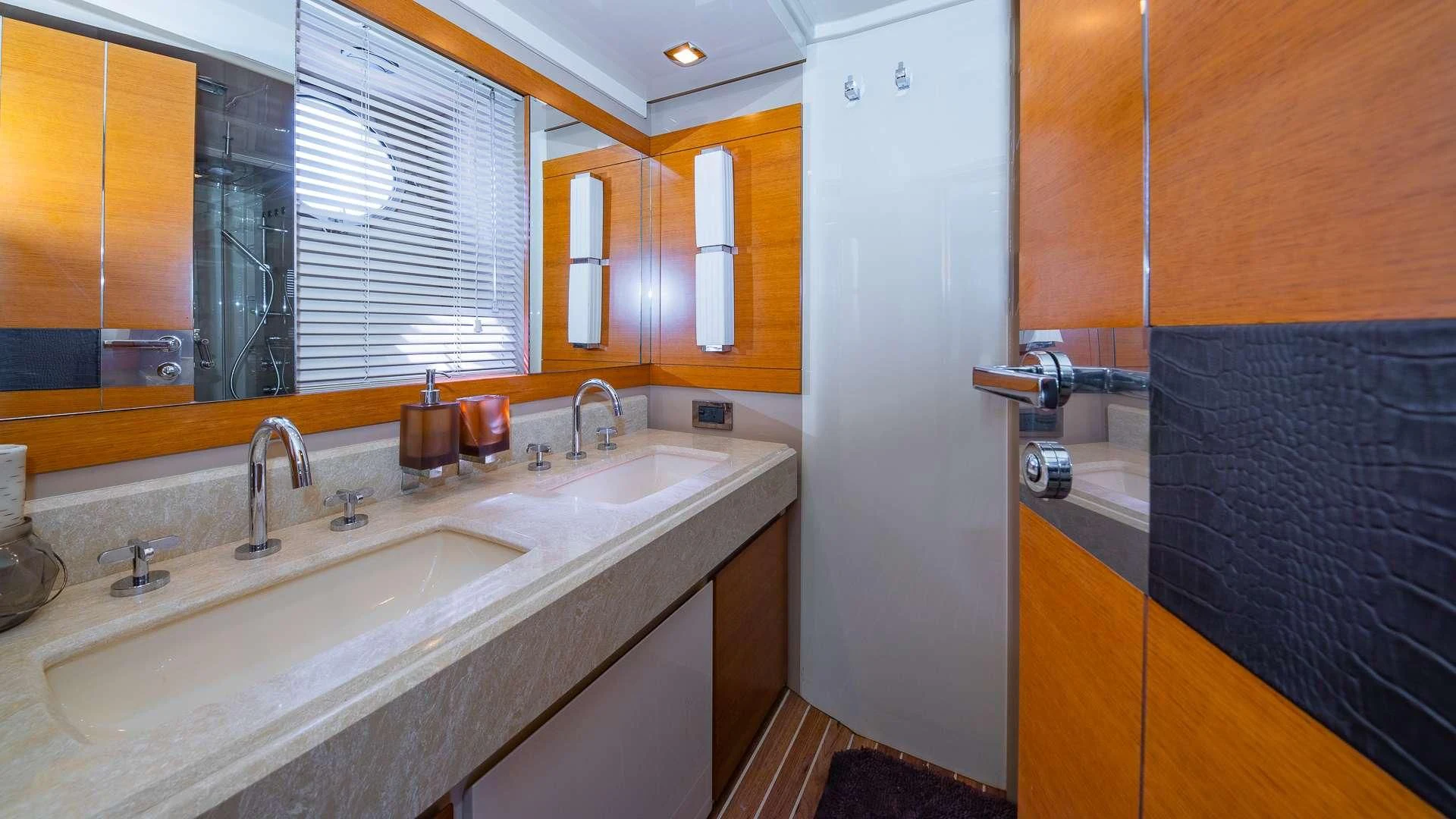 a bathroom with a sink and a mirror aboard WICKED Yacht for Sale
