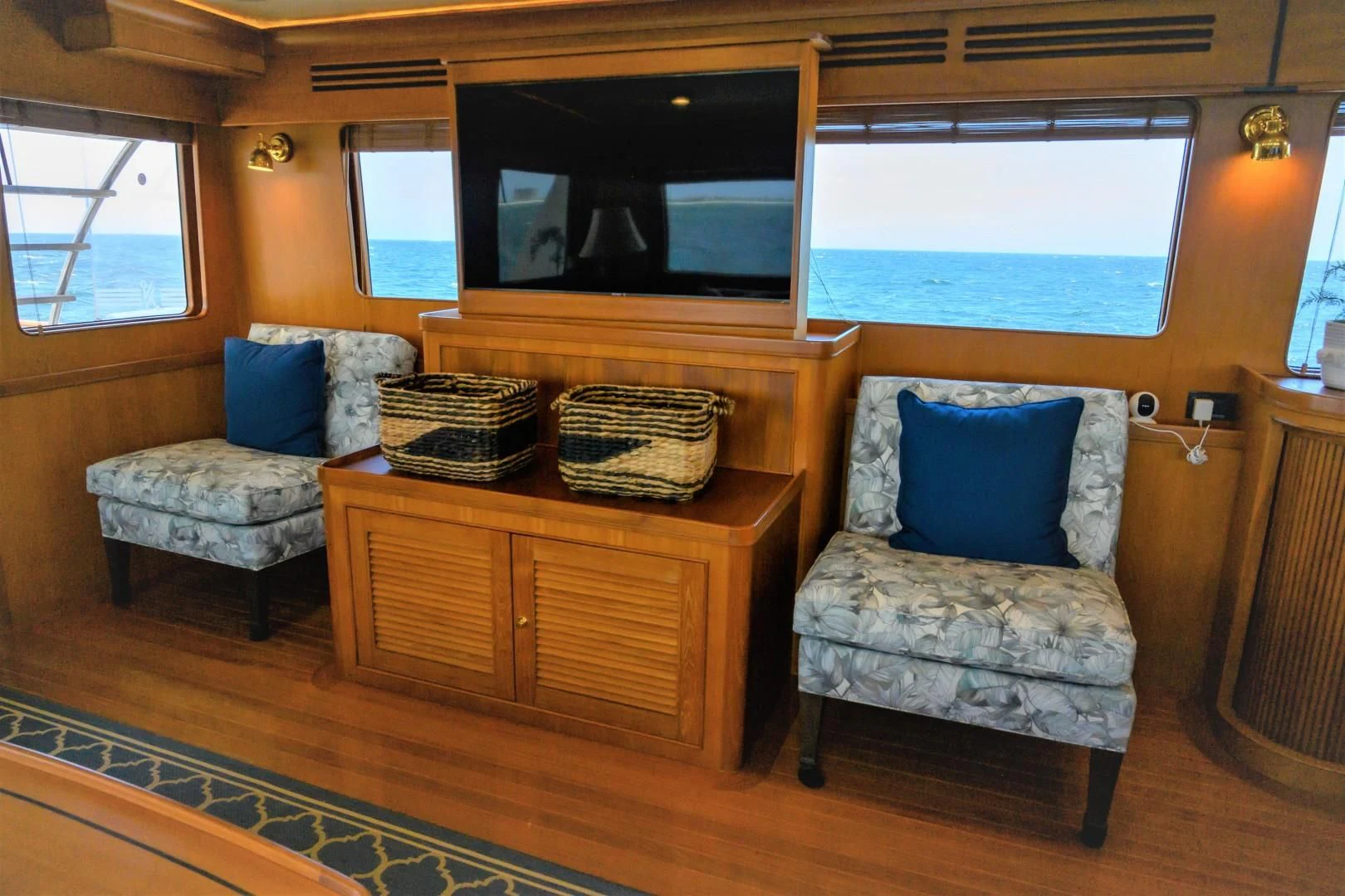 a living room with a couch and a television aboard VK Yacht for Sale